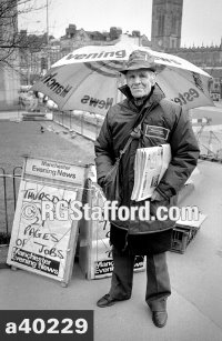 Man selling the Manchester Evening News, Manchester, 1989. 